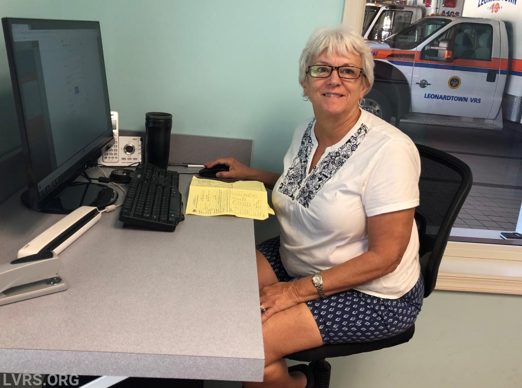 The lovely Mary Cox doing her paperwork after a busy night.