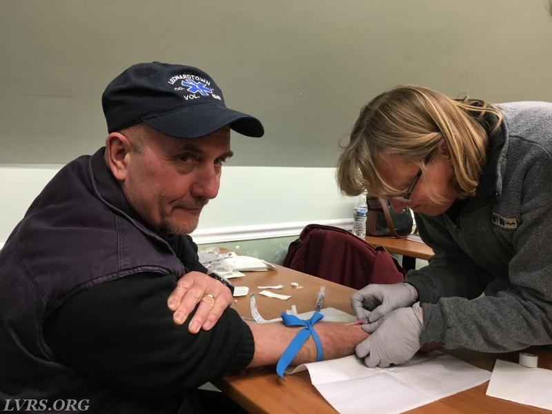 Carol sticking Jake at her IV class.